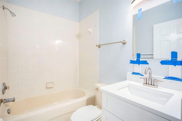 bathroom featuring toilet, vanity, and bathing tub / shower combination