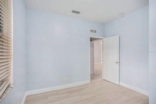 empty room with light wood-type flooring