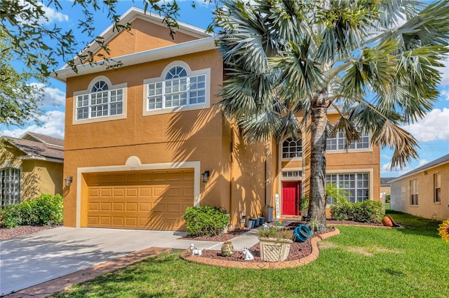 view of front facade with a front lawn and a garage