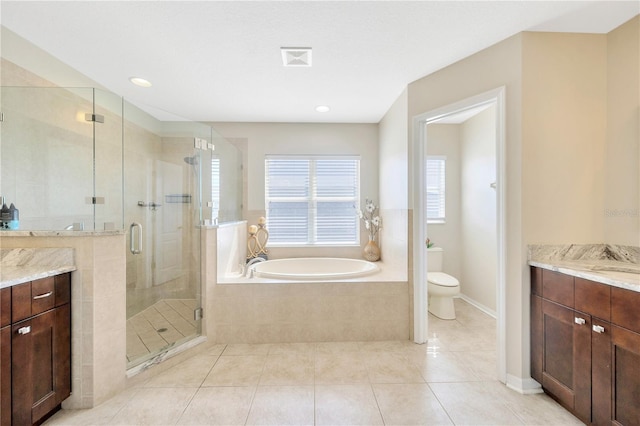 full bathroom featuring vanity, separate shower and tub, toilet, and tile patterned flooring