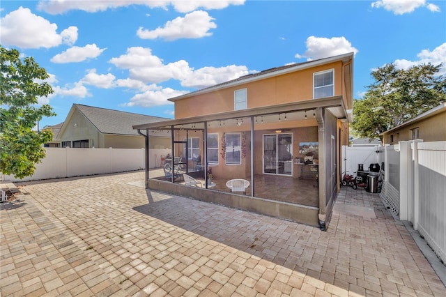 rear view of house with a patio