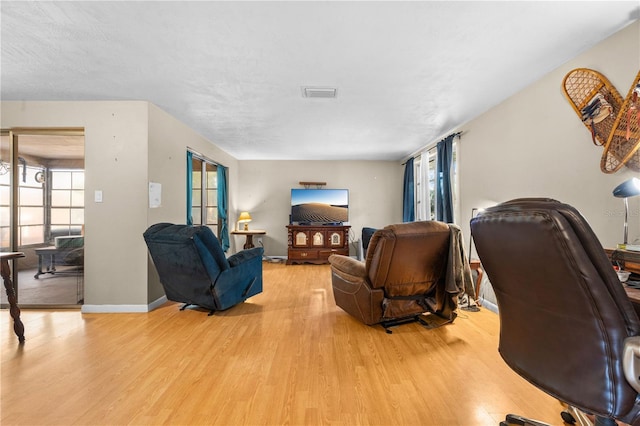 living room with light hardwood / wood-style floors