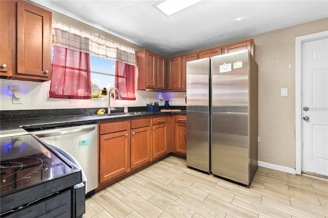 kitchen featuring stainless steel appliances, tasteful backsplash, and sink