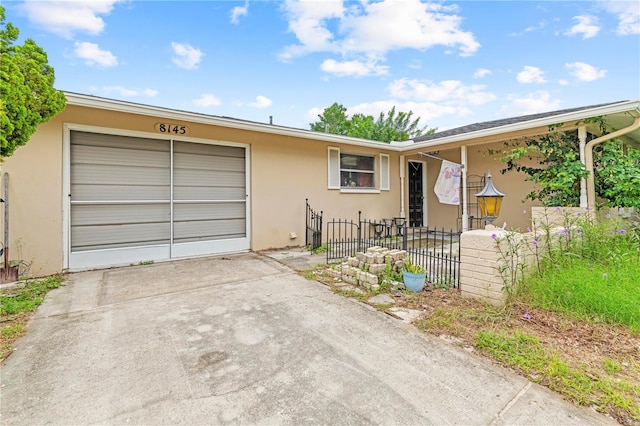 single story home featuring a garage