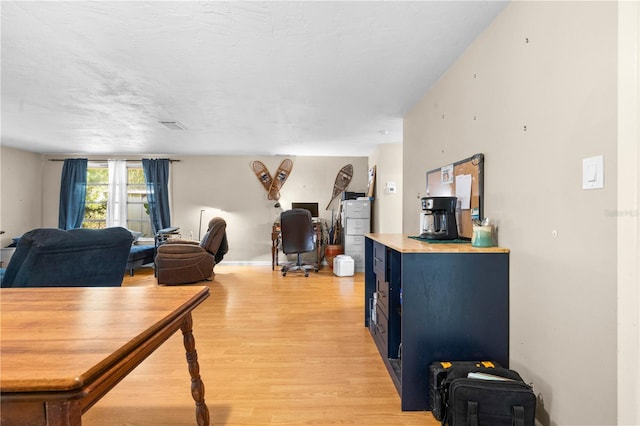 office space with hardwood / wood-style floors and a textured ceiling