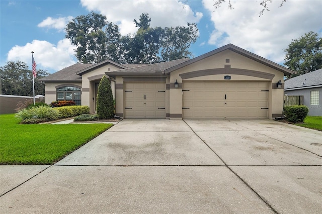 ranch-style house featuring a garage and a front yard