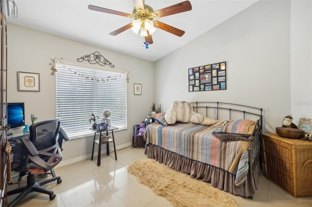 tiled bedroom featuring ceiling fan and vaulted ceiling