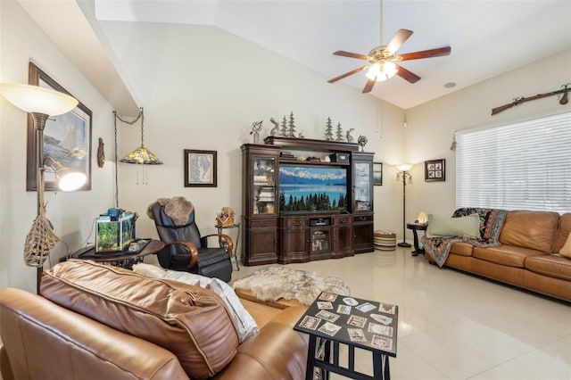 living room featuring vaulted ceiling, light tile patterned flooring, and ceiling fan