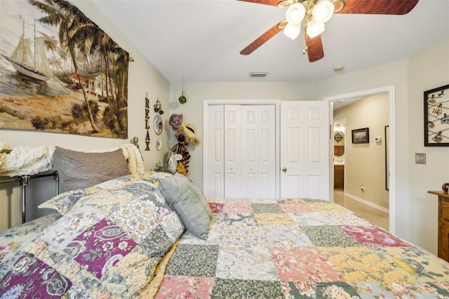 bedroom featuring ceiling fan and a closet