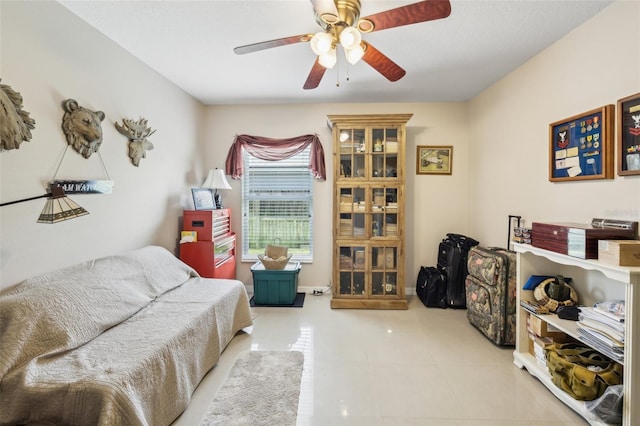 interior space with ceiling fan