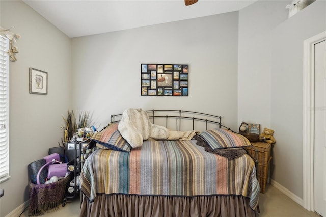 carpeted bedroom featuring lofted ceiling