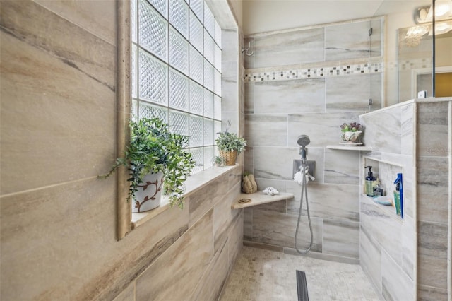 bathroom featuring tiled shower