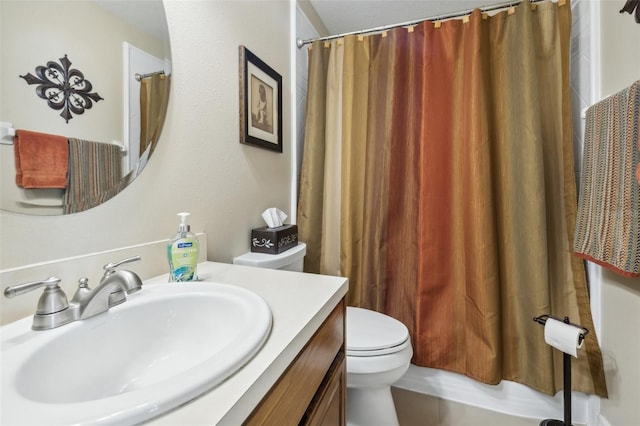 bathroom featuring vanity, toilet, and a shower with curtain