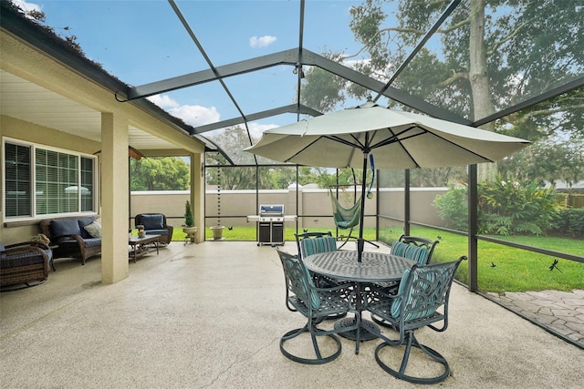 view of patio / terrace featuring a grill and glass enclosure