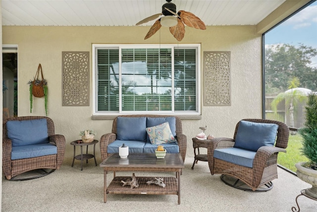 sunroom with ceiling fan and wooden ceiling