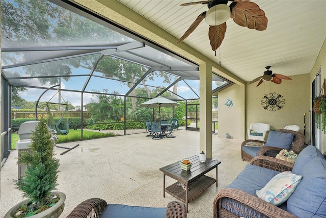 view of patio / terrace with a lanai and ceiling fan