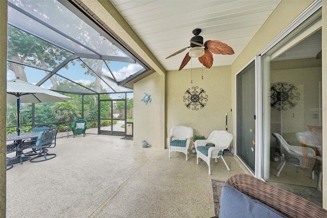 sunroom / solarium with wooden ceiling and ceiling fan