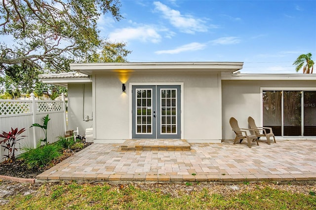 back of house with a patio area and french doors