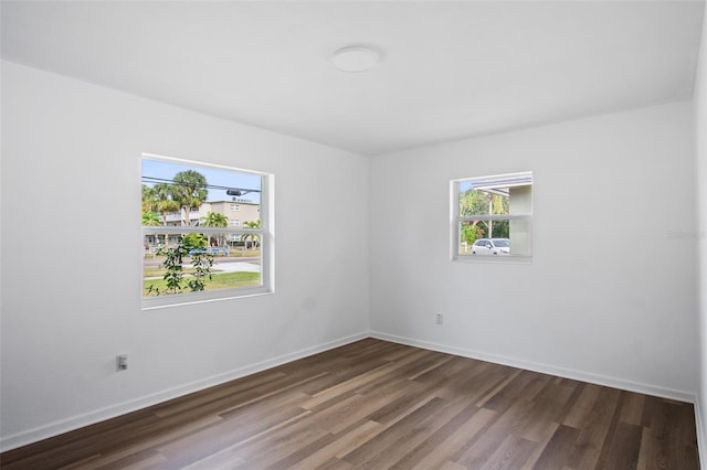 empty room featuring dark hardwood / wood-style floors