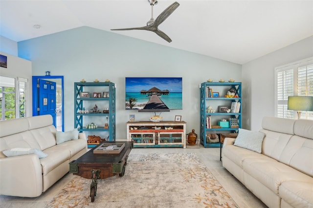 tiled living room featuring lofted ceiling and ceiling fan