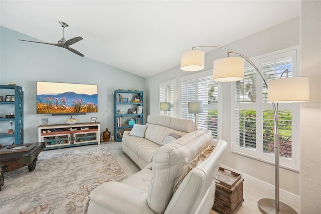 living room featuring ceiling fan and vaulted ceiling