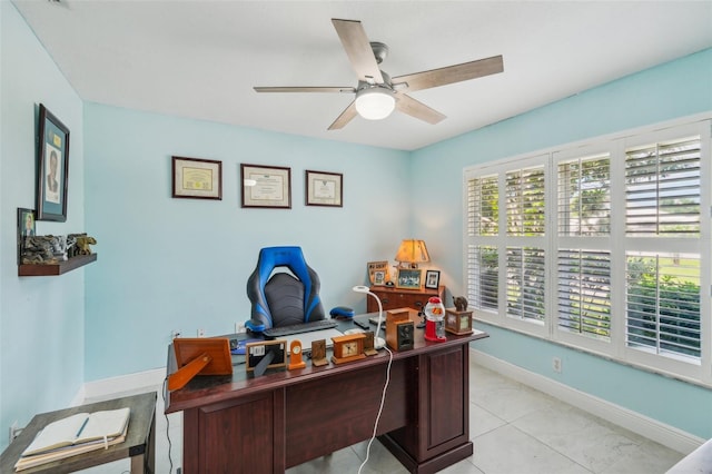 tiled office space featuring ceiling fan