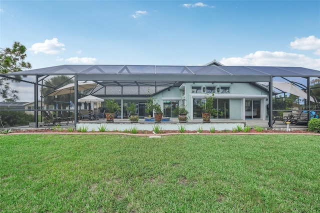 exterior space featuring a yard and glass enclosure