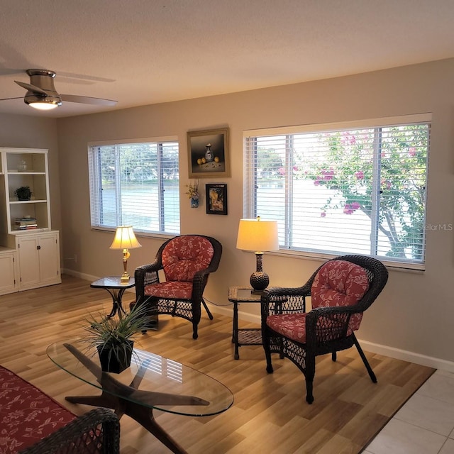 sitting room with light wood finished floors and baseboards