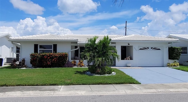 single story home featuring an attached garage, stucco siding, a front lawn, and a tiled roof