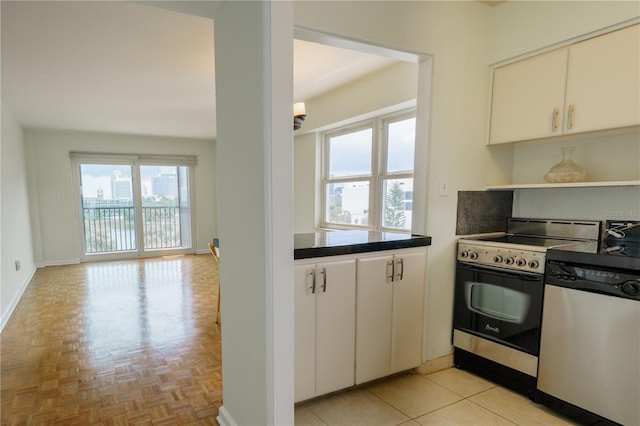 kitchen featuring open shelves, stainless steel dishwasher, dark countertops, electric range oven, and baseboards