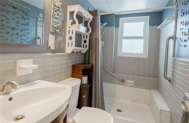 bathroom featuring vanity, walk in shower, tasteful backsplash, tile walls, and toilet