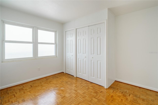 unfurnished bedroom featuring baseboards