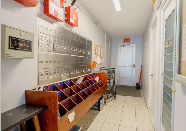 interior space featuring light tile patterned floors and mail boxes