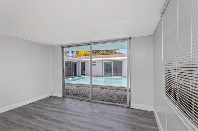 unfurnished room featuring wood-type flooring