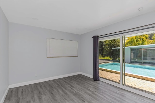 unfurnished room featuring hardwood / wood-style floors