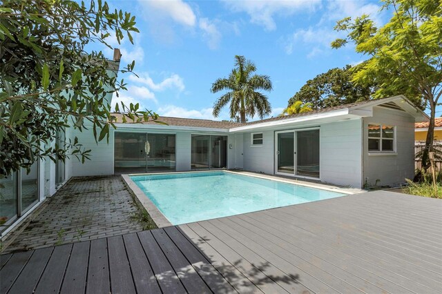 view of swimming pool featuring a deck