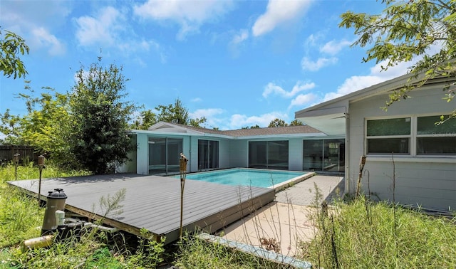 view of swimming pool with a wooden deck