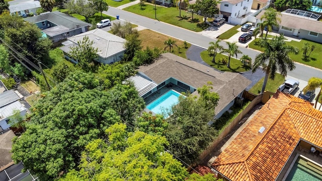 birds eye view of property with a residential view