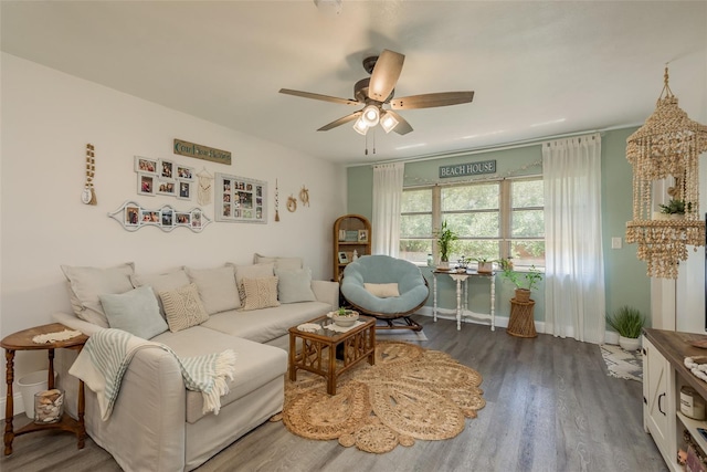 living room with ceiling fan and dark hardwood / wood-style floors