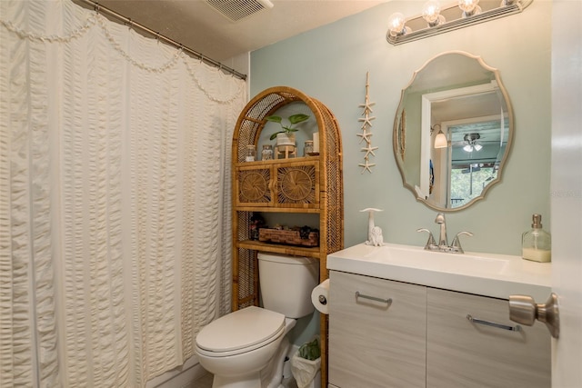 bathroom with curtained shower, toilet, a textured ceiling, and vanity