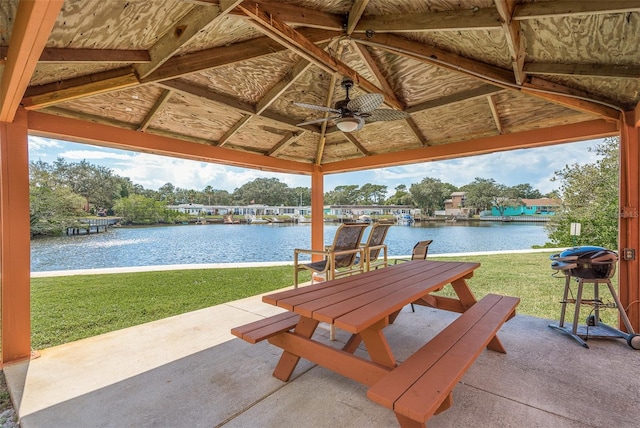 view of patio / terrace featuring a water view, ceiling fan, and a gazebo