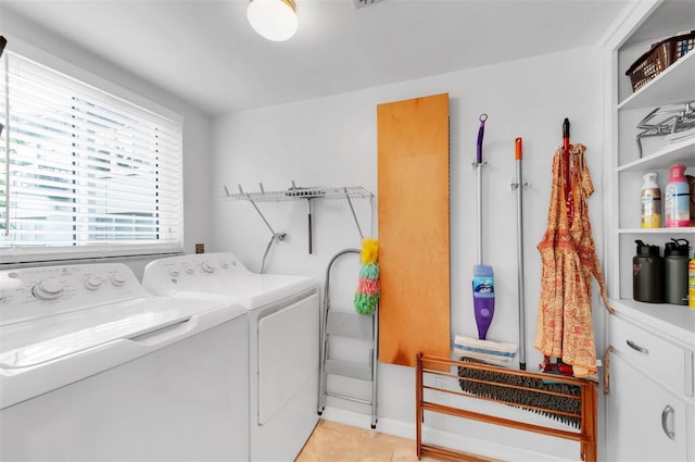 washroom with light tile patterned floors and independent washer and dryer