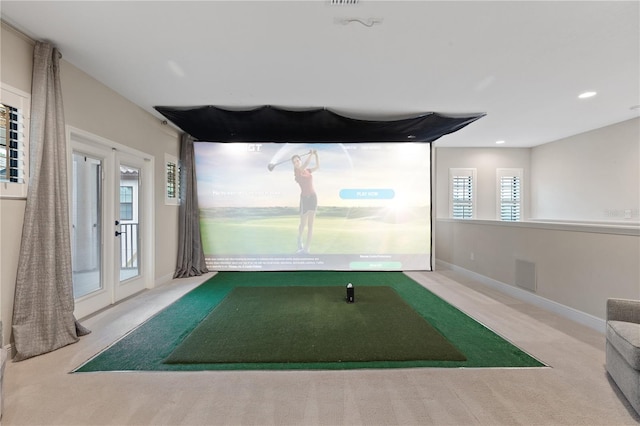 recreation room featuring light carpet