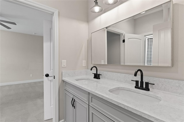 bathroom featuring ceiling fan and vanity