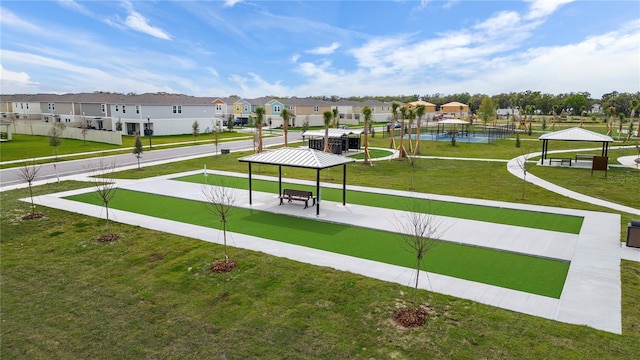 view of home's community with a gazebo and a yard