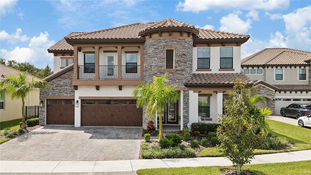 mediterranean / spanish-style house with a garage