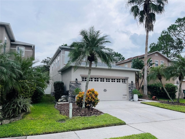 view of front facade featuring a garage and a front yard