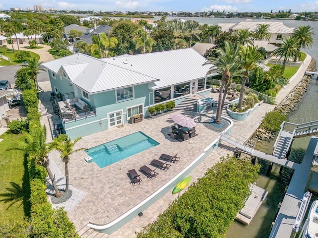 birds eye view of property featuring a water view