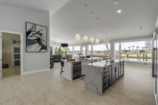 kitchen with a chandelier, decorative light fixtures, a center island, vaulted ceiling, and stainless steel dishwasher