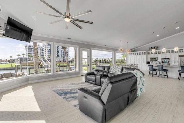 living room with lofted ceiling, ceiling fan, and crown molding